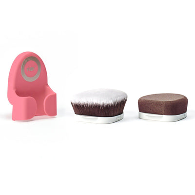 Candy pink colored Yubi Buff and Blend Duo handle sitting next to velvety soft brown and white-tipped brush and sponge attachments.